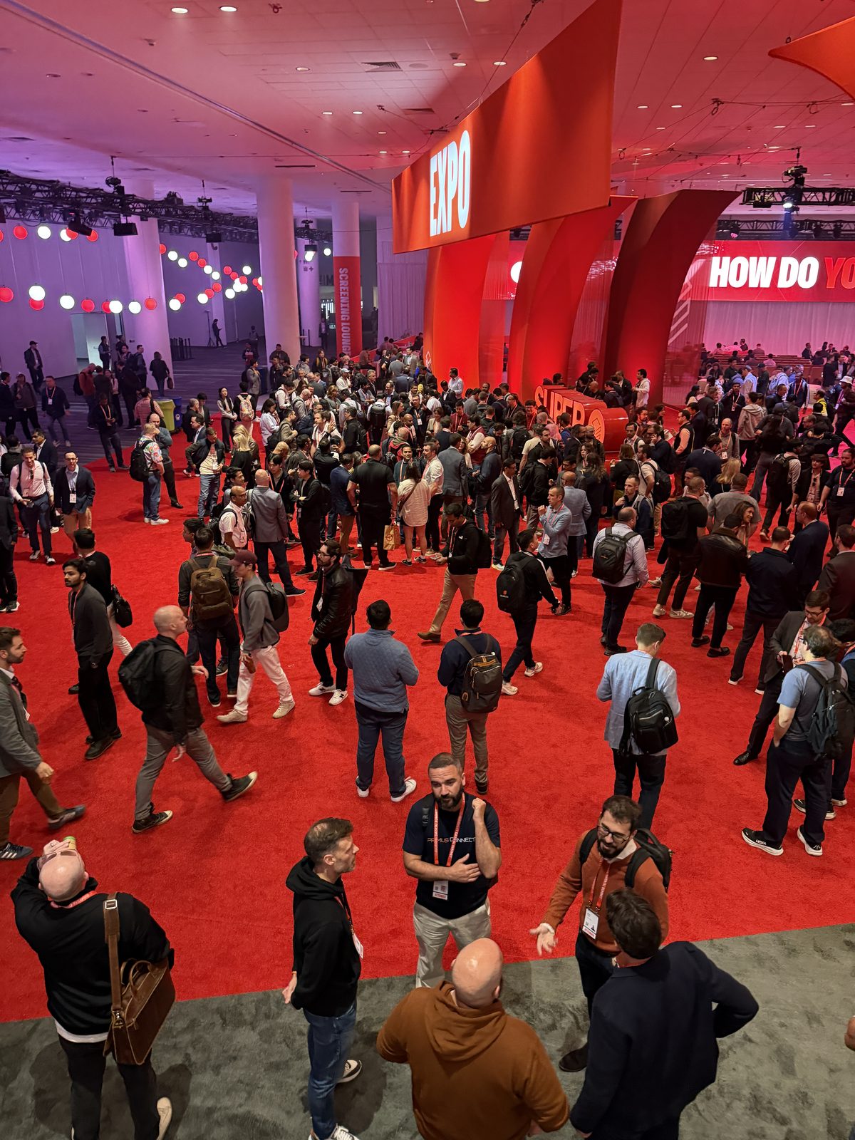 Hall floor packed with attendees
